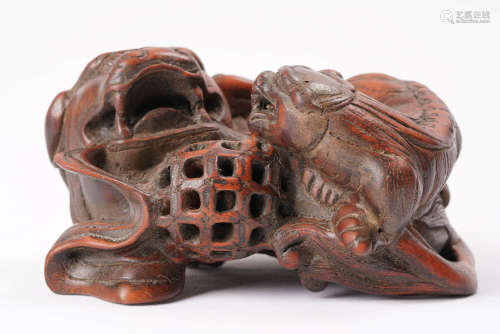 A Chinese Carved Eaglewood Beast Ornament