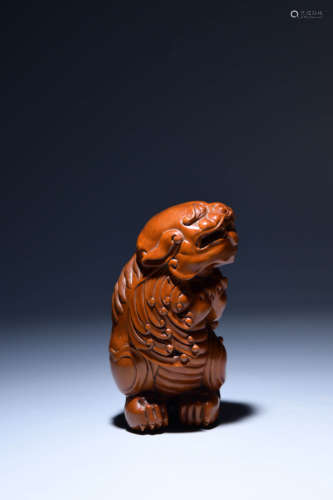 A Chinese Carved Boxwood Lion Ornament