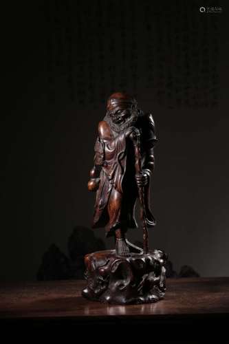 A Chinese Carved Rosewood Tie Guaili Statue