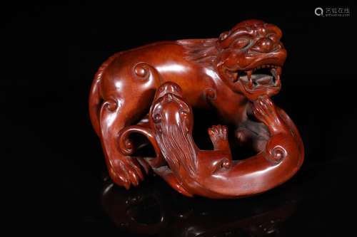 A Chinese Carved Boxwood Beast Ornament