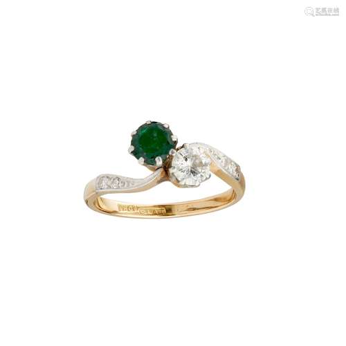 An emerald and diamond set twist ring