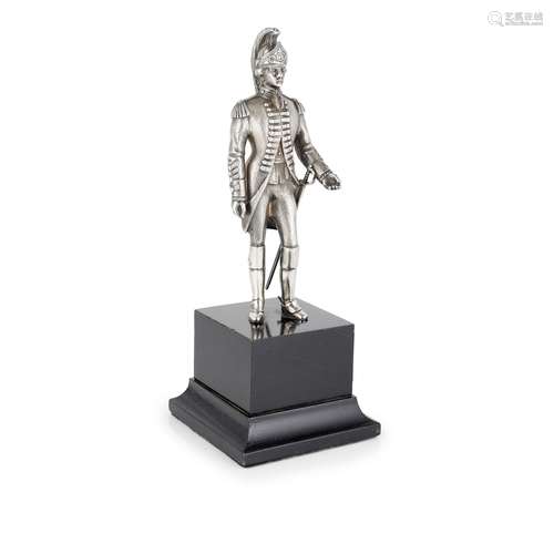 A cast silver figure of a soldier