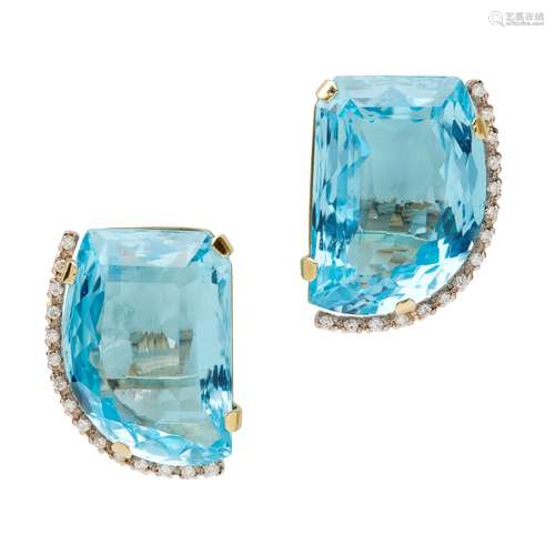 A pair of blue topaz and diamond set earrings