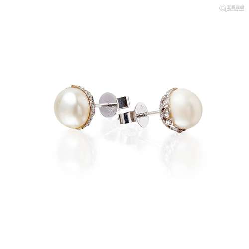 A pair of natural pearl and diamond set earrings