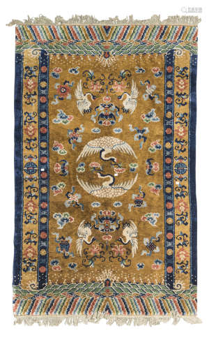 A BEIJING CARPET WITH GOLD GROUND CENTER FIELD AND BARBERSHOP BORDERS EARLY 20TH CENTURY
