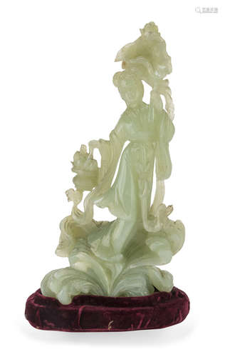 A CHINESE SERPENTINE SCULPTURE OF HE XIANGU 20TH CENTURY.