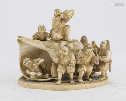 AN ALLEGORICAL JAPANESE IVORY GROUP LATE 19TH CENTURY.