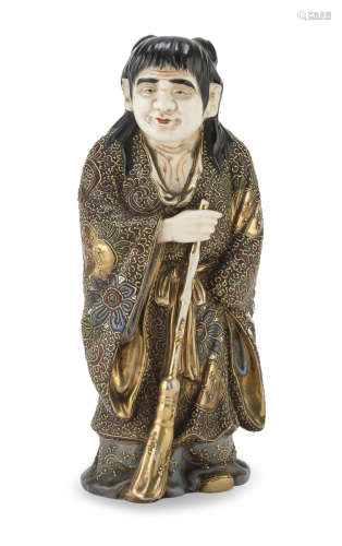 A JAPANESE POLYCHROME ENAMELED CERAMIC SCULPTURE REPRESENTING JITTOKU EARLY 20TH CENTURY.