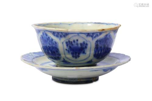 * A BLUE AND WHITE POTTERY BOWL WITH SAUCER