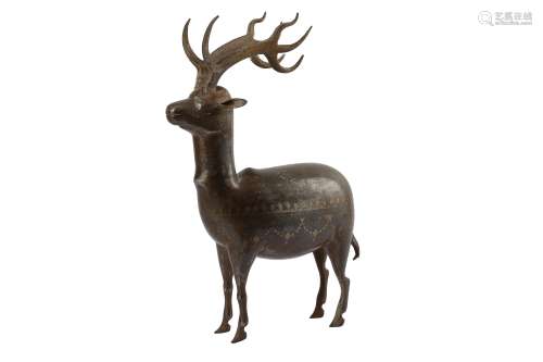 * A LARGE QAJAR GOLD-DAMASCENED STEEL DEER