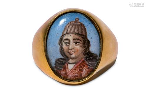 * A GOLD RING WITH A POLYCHROME-PAINTED ENAMEL PORTRAIT OF A QAJAR YOUTH