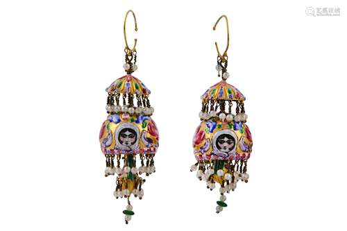 * A PAIR OF QAJAR POLYCHROME-ENAMELLED GILT-COPPER EARRINGS