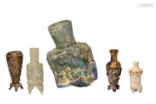 * FOUR SMALL EARLY ISLAMIC GLASS OINTMENT FLASKS AND A MISFIRED BOTTLE