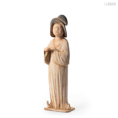 A PAINTED POTTERY FIGURE OF A COURT LADY Tang dynasty