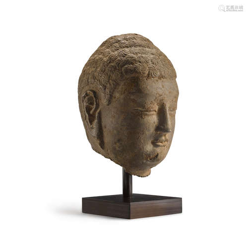 A LIMESTONE HEAD OF BUDDHA Northern Qi