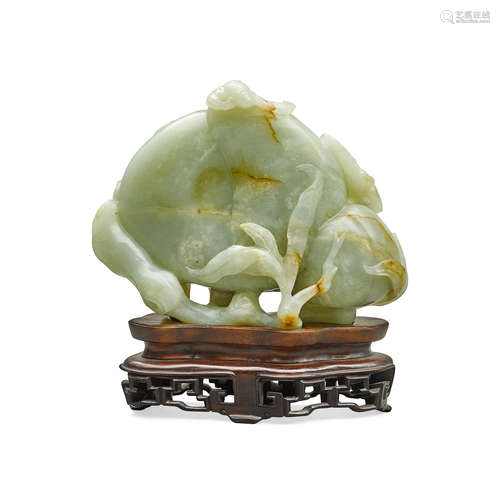 A CELADON JADE 'BATS AND PEACHES' CARVING Qing dynasty