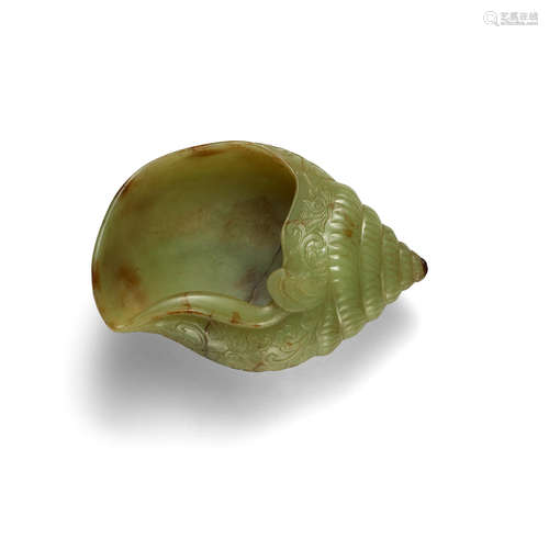 A YELLOW JADE 'CONCH SHELL' WASHER