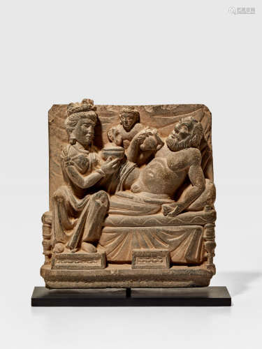 A SCHIST PANEL WITH A BACCHANALIAN SCENE ANCIENT REGION OF GANDHARA, 2ND/3RD CENTURY