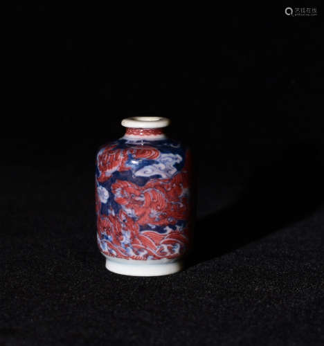 A QING DYNASTY  UNDERGLAZED RED SNUFF BOTTLE PAINTED WITH NINE LIONS