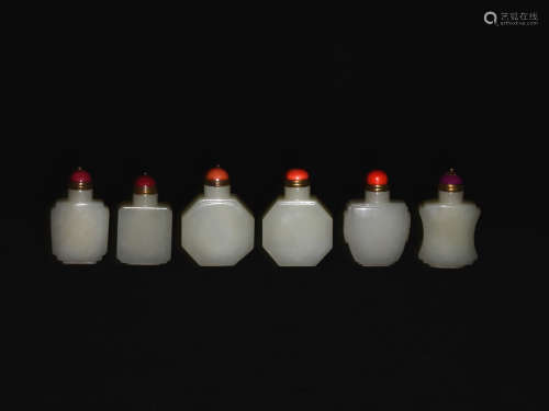 A GROUP OF SIX WHITE JADE SNUFF BOTTLES