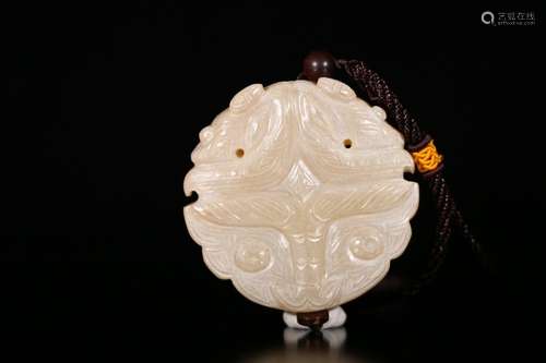 A Chinese Beast Carved Gaogu Jade Pendant