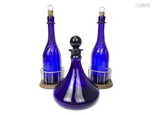 A PAIR OF WILLIAM IV BRISTOL BLUE GLASS DECANTERS AND A SHIPS DECANTER