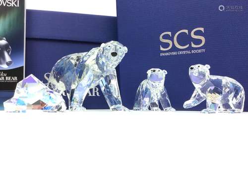 A SWAROVSKI CRYSTAL FIGURE OF A SIKU POLAR BEAR ALONG WITH A PAIR OF CUBS