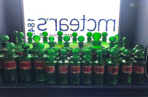 A LOT OF EARLY 20TH CENTURY GREEN GLASS PHARMACEUTICAL BOTTLES