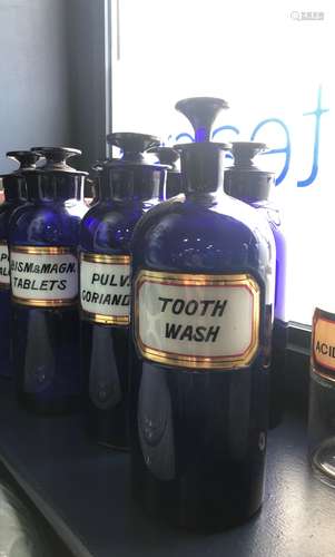 A LOT OF EARLY 20TH CENTURY BLUE GLASS PHARMACEUTICAL BOTTLES