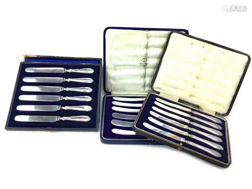 A LOT OF THREE SETS OF SILVER MOUNTED TEA KNIVES