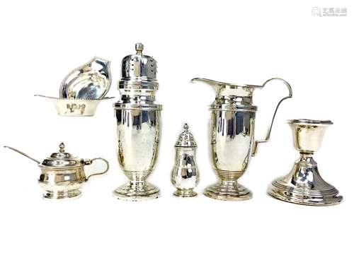 A SILVER SUGAR CASTER, A CREAMER, TWO SALTS, PEPPERETTE, MUSTARD POT, AND CANDLESTICK