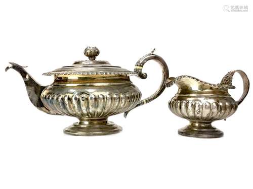 A GEORGE III SILVER TEAPOT AND CREAMER