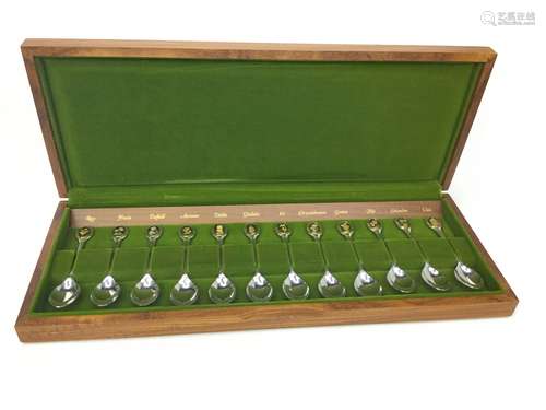 A SET OF TWELVE ROYAL HORTICULTURAL SOCIETY SILVER SPOONS