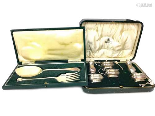 A PAIR OF CASED SILVER SERVERS ALONG WITH A CASED SILVER CRUET