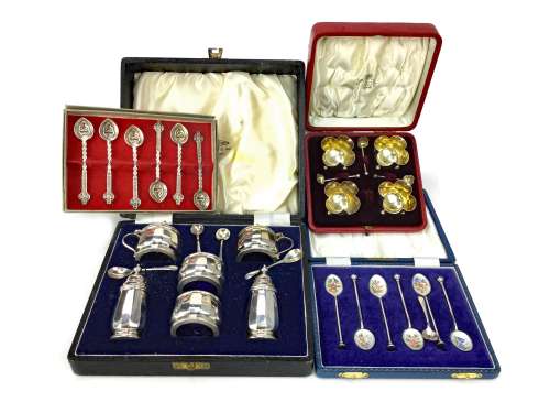 A SILVER CRUET SET ALONG WITH A SALT SET AND TWO CASED SET OF SPOONS