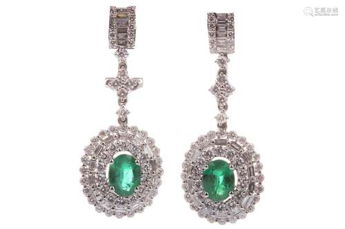 PAIR OF EMERALD AND DIAMOND EARRINGS, the oval emeralds surrounded by round brilliant and baguette