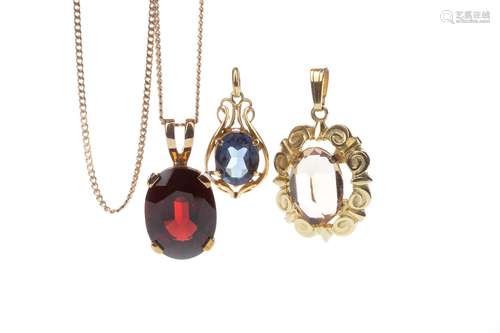 THREE GEM SET PENDANTS, comprising a red garnet pendant, in nine carat gold, on a nine carat gold