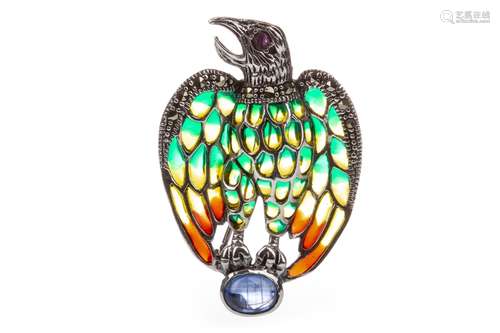 A PLIQUE-A-JOUR EAGLE BROOCH, with a round ruby eye and green, yellow and red enamelled wings