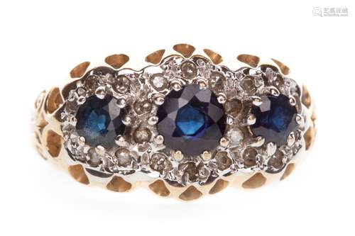 SAPPHIRE AND DIAMOND CLUSTER RING, the three graduated sapphires within a border of round