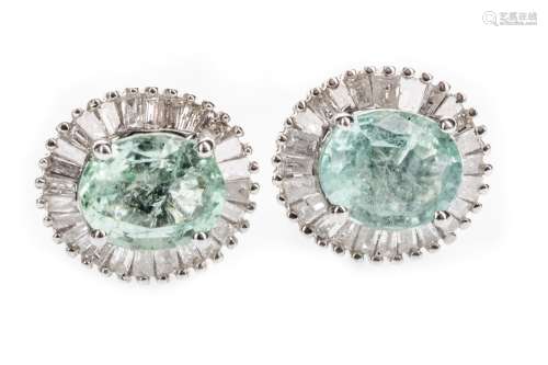 GREEN GEM SET AND DIAMOND EARRINGS, the oval green gem within a halo of tapered baguette cut