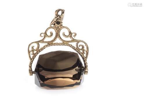 GEM SET SWIVEL FOB, set with a faceted brown gem , on a nine carat gold scrollwork mount, 7.2g