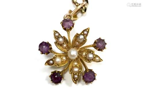 EDWARDIAN PURPLE GEM SET AND PEARL PENDANT, the pearl set flower with radiating purple gem set