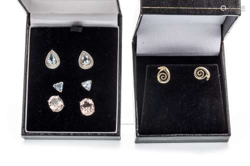 PAIR OF BLUE GEM SET AND DIAMOND EARRINGS, the pear shaped blue gems flanked by three round