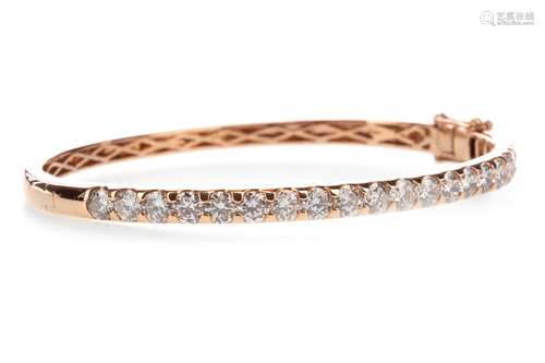 DIAMOND BANGLE, set with a row of round brilliant cut diamonds totalling approximately 4.21