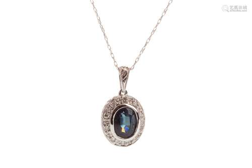 SAPPHIRE SET AND DIAMOND PENDANT, the oval sapphire surrounded by round brilliant cut diamonds