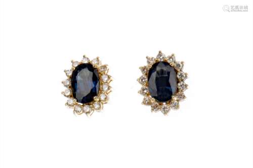 PAIR OF SAPPHIRE AND DIAMOND EARRINGS, each set with an oval sapphire within a round brilliant cut