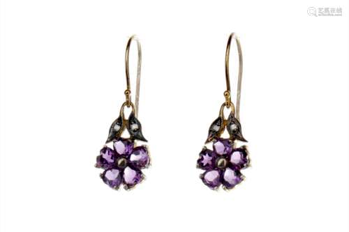 PAIR OF AMETHYST AND DIAMOND EARRINGS, the heart shaped amethyst stones forming a daisy, flanked