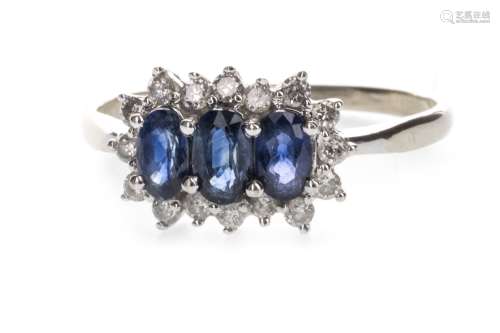 BLUE GEM AND DIAMOND RING, the three graduated blue gems surrounded by diamonds, marked 14KT