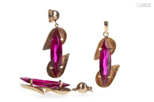 GEM SET PENDANT AND MATCHING EARRINGS, the pendant formed by two pear shaped sections connected by a