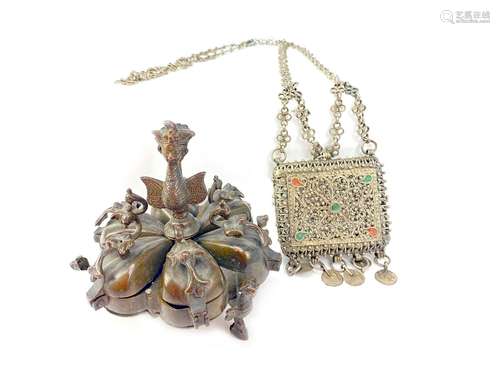 AN EASTERN BRONZE SPICE BOX AND A FILIGREE PURSE